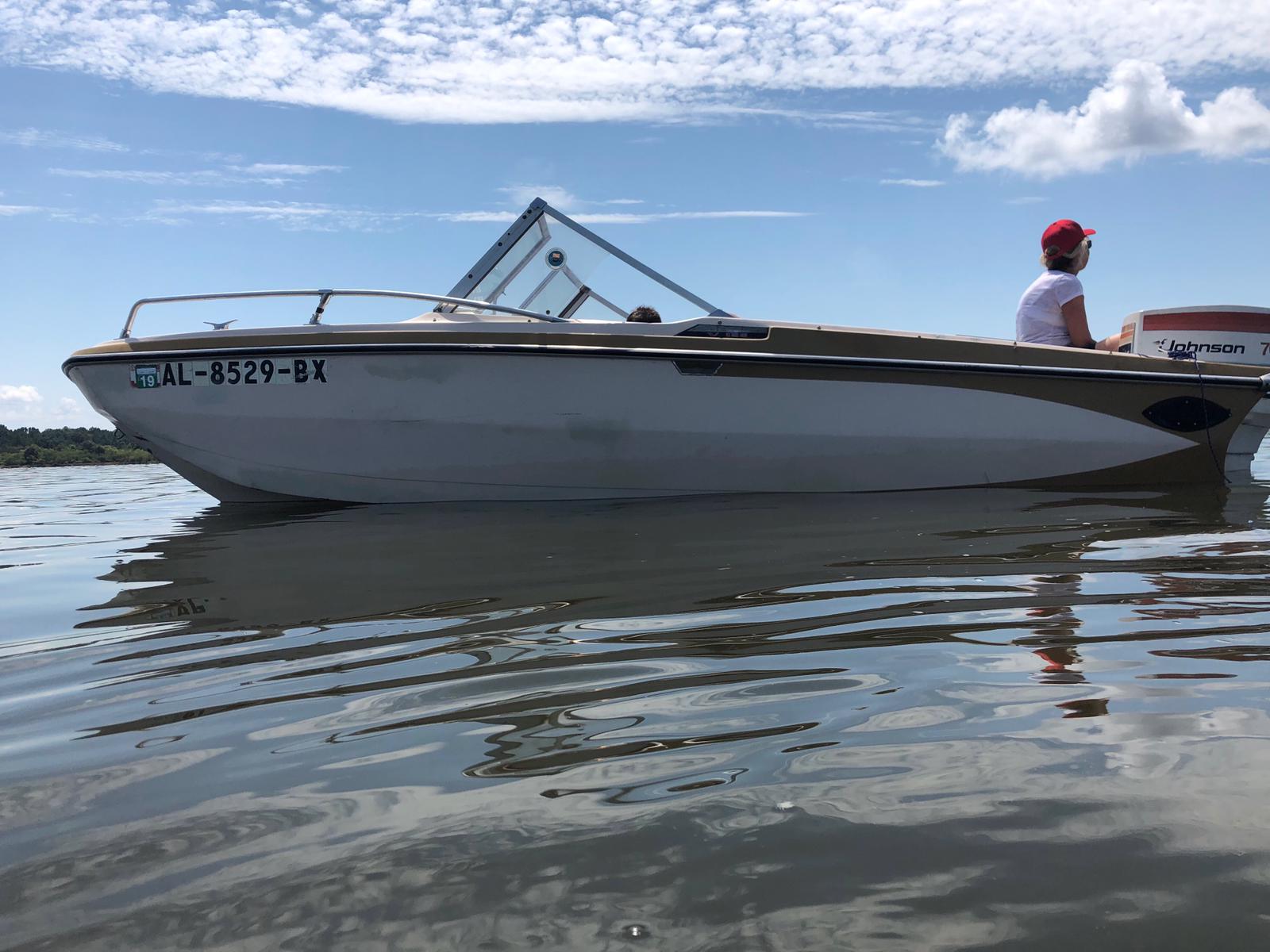 closeup shot of a boat and a woman in it