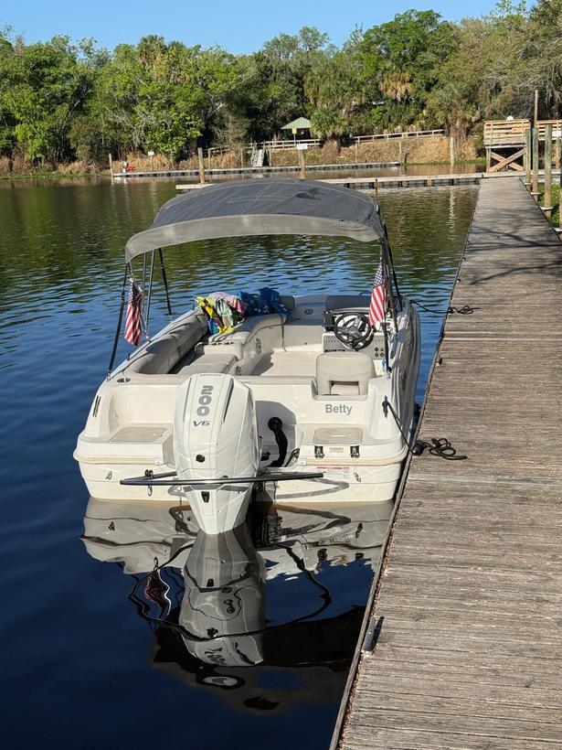 The 20ft Hurricane deck boat Betty tied alongside the dock