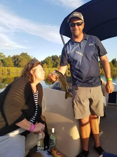 Guests fishing from the boat on West Lake Toho