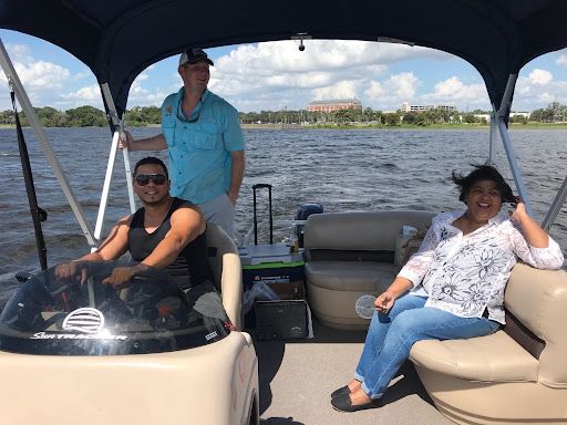 Guests enjoying a family day on the pontoon boat on West Lake Toho